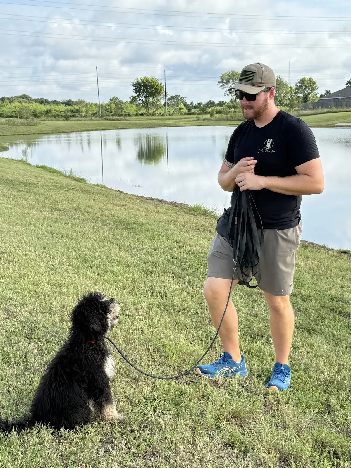 Our trainer working a Best Dog University dog at the edge of the lake